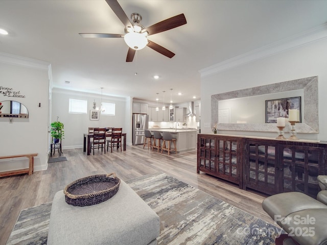 647 R L Stowe Rd, Belmont, NC 28012 - living room with crown molding, light wood-style flooring, a ceiling fan, baseboards, and recessed lighting