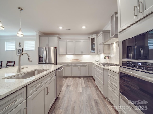 647 R L Stowe Rd, Belmont, NC 28012 - kitchen featuring appliances with stainless steel finishes, wall chimney range hood, a sink, glass insert cabinets, and backsplash