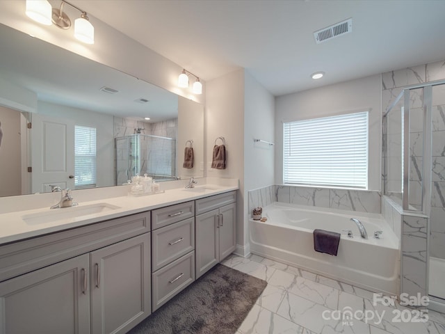 647 R L Stowe Rd, Belmont, NC 28012 - bathroom with a garden tub, marble look tile flooring, double vanity, a shower stall, and recessed lighting
