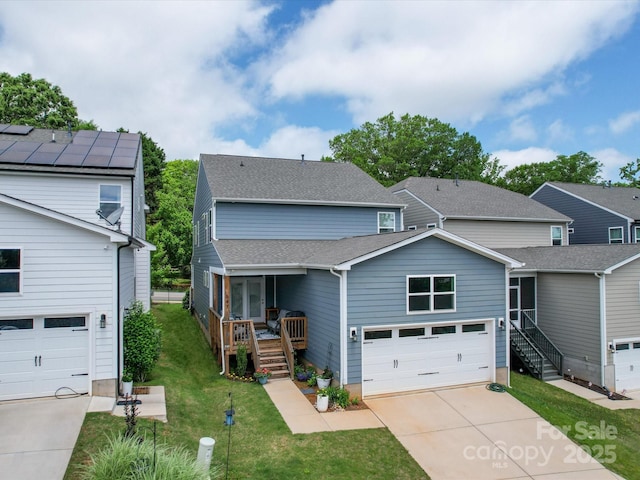 647 R L Stowe Rd, Belmont, NC 28012 - traditional-style house with concrete driveway, a front lawn, stairs, and an attached garage
