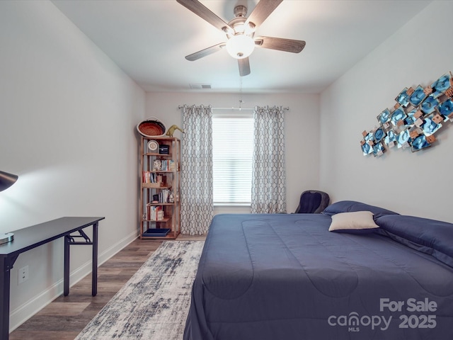 647 R L Stowe Rd, Belmont, NC 28012 - bedroom with dark wood-type flooring, baseboards, and a ceiling fan