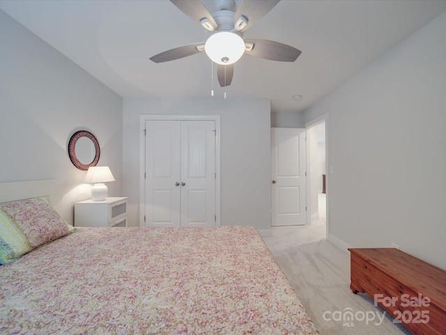 647 R L Stowe Rd, Belmont, NC 28012 - bedroom with light carpet, a closet, ceiling fan, and baseboards
