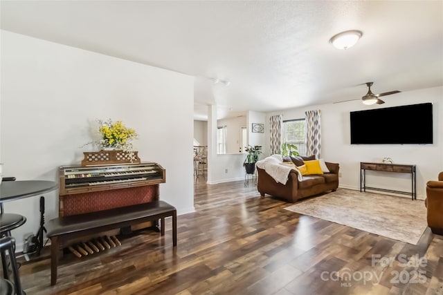 925 Skywatch Ln, Monroe, NC 28112 - living area with ceiling fan, wood finished floors, and baseboards