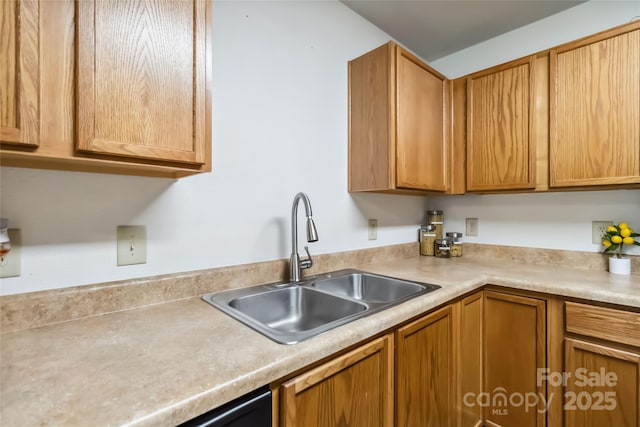 925 Skywatch Ln, Monroe, NC 28112 - kitchen with a sink, light countertops, and brown cabinets