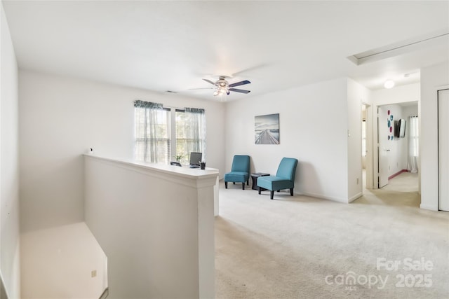 925 Skywatch Ln, Monroe, NC 28112 - sitting room featuring attic access, light carpet, ceiling fan, and baseboards