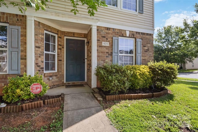 925 Skywatch Ln, Monroe, NC 28112 - property entrance featuring covered porch and a yard
