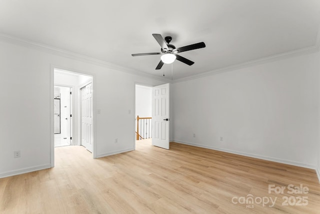 9513 Saddle Run Trl, Charlotte, NC 28269 - empty room with crown molding, a ceiling fan, light wood-style floors, and baseboards
