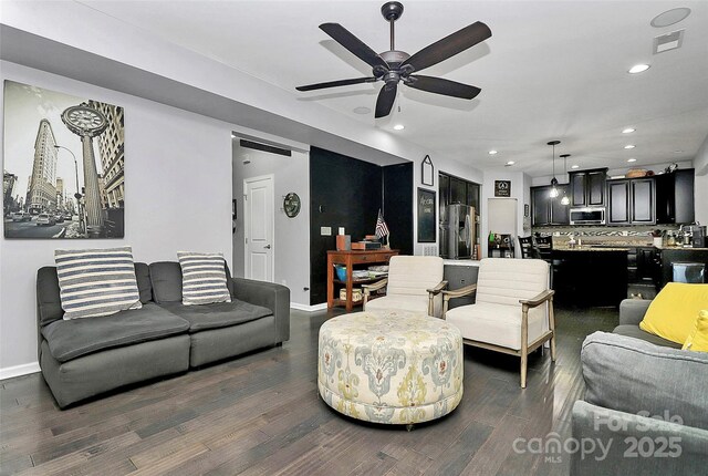 7434 Dover Mill Ln SW, Concord, NC 28025 - living room featuring dark wood-style flooring, a ceiling fan, recessed lighting, and baseboards