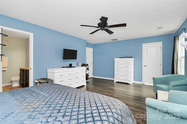 7434 Dover Mill Ln SW, Concord, NC 28025 - bedroom with wood finished floors, baseboards, ensuite bath, and a ceiling fan