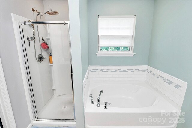 7434 Dover Mill Ln SW, Concord, NC 28025 - full bathroom featuring a shower stall and a garden tub
