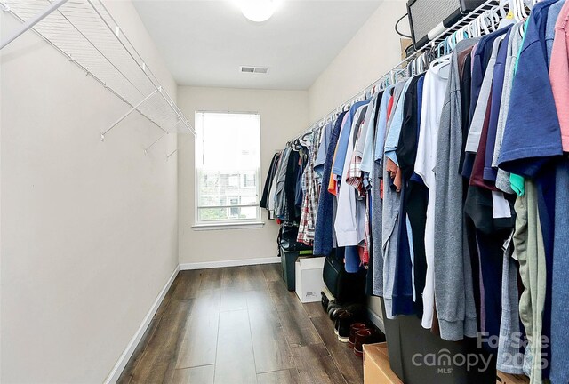7434 Dover Mill Ln SW, Concord, NC 28025 - walk in closet featuring wood finished floors