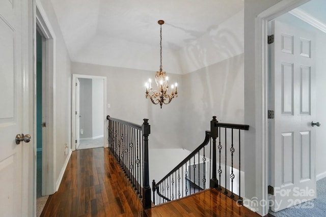 8708 Piccone Brook Ln, Charlotte, NC 28216 - hall with an upstairs landing, wood-type flooring, a chandelier, baseboards, and lofted ceiling