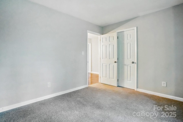 8708 Piccone Brook Ln, Charlotte, NC 28216 - unfurnished bedroom with carpet flooring and baseboards