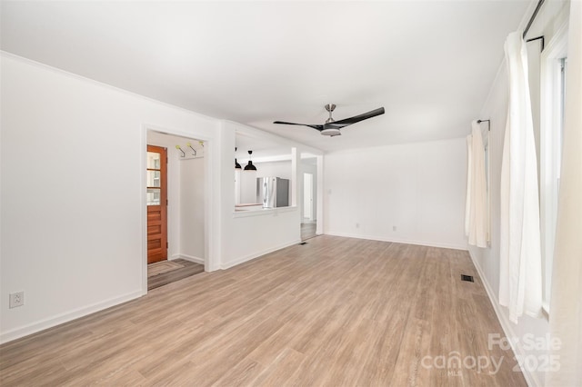 3595 Mt Holly Rd, Edgemoor, SC 29712 - unfurnished living room with ceiling fan, light wood-style floors, and baseboards
