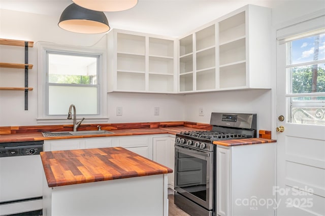 3595 Mt Holly Rd, Edgemoor, SC 29712 - kitchen featuring butcher block countertops, stainless steel range with gas cooktop, white dishwasher, and a sink