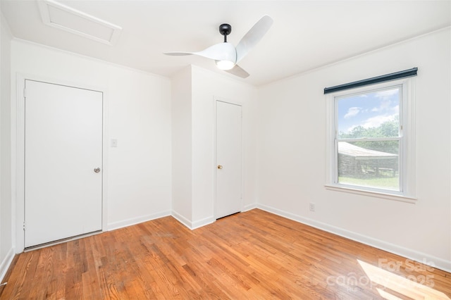 3595 Mt Holly Rd, Edgemoor, SC 29712 - unfurnished room with attic access, light wood-type flooring, baseboards, and ceiling fan