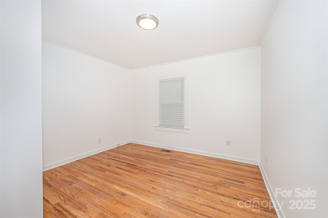 3595 Mt Holly Rd, Edgemoor, SC 29712 - unfurnished room featuring light wood finished floors, baseboards, and crown molding