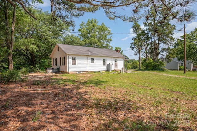 3595 Mt Holly Rd, Edgemoor, SC 29712 - back of house featuring a chimney and a lawn