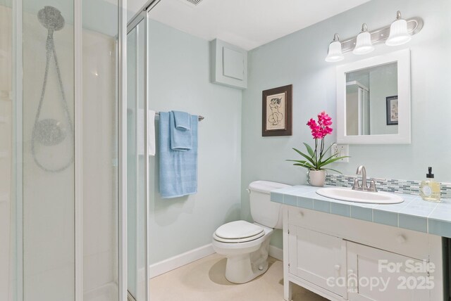 20 Pickens Ln, Weaverville, NC 28787 - bathroom featuring vanity, toilet, a shower stall, and baseboards