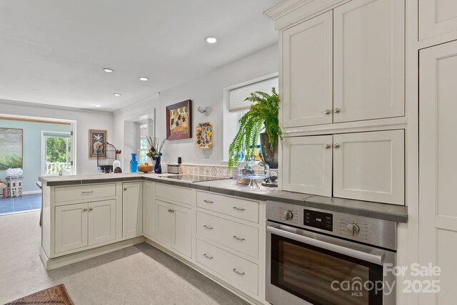 20 Pickens Ln, Weaverville, NC 28787 - kitchen with stainless steel oven, a peninsula, recessed lighting, light countertops, and concrete floors
