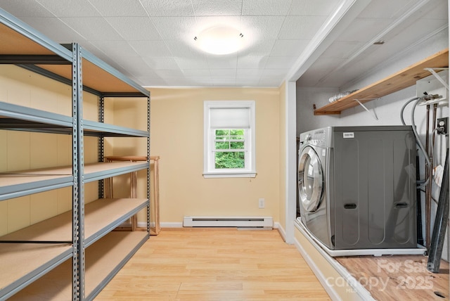 20 Pickens Ln, Weaverville, NC 28787 - washroom featuring light wood-type flooring, a baseboard radiator, washer / clothes dryer, and baseboards