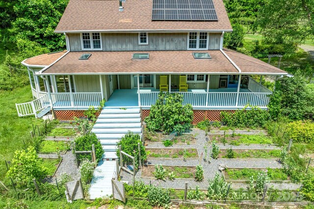 20 Pickens Ln, Weaverville, NC 28787 - view of front of property with a garden, a porch, solar panels, and a shingled roof