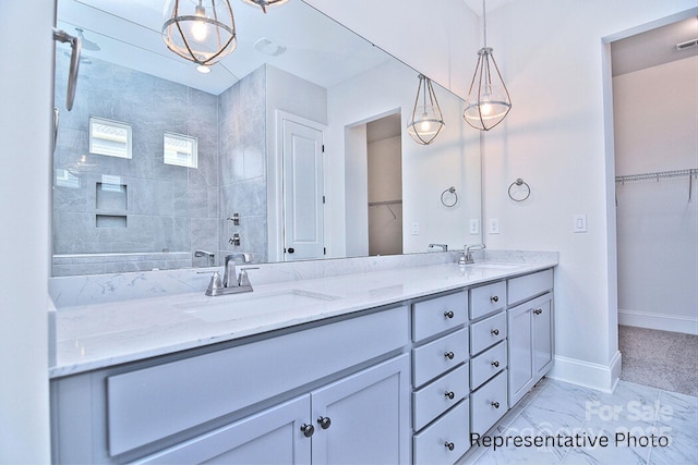 4178 Millstream Rd, Denver, NC 28037 - full bath featuring double vanity, baseboards, a walk in closet, and marble finish flooring