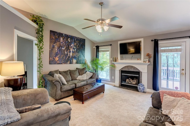 1209 Danielle Downs Ct SE, Concord, NC 28025 - living room featuring ceiling fan, lofted ceiling, a tile fireplace, carpet flooring, and healthy amount of natural light