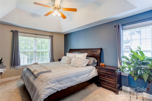 1209 Danielle Downs Ct SE, Concord, NC 28025 - bedroom with a tray ceiling, light colored carpet, baseboards, and ceiling fan