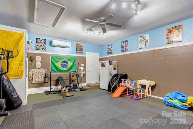 1209 Danielle Downs Ct SE, Concord, NC 28025 - game room with attic access, track lighting, ceiling fan, an AC wall unit, and baseboards
