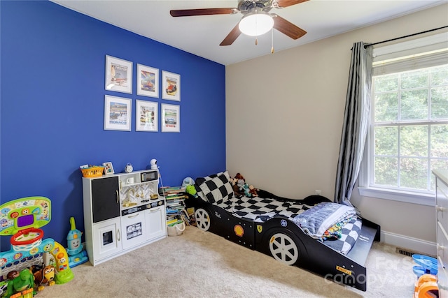 1209 Danielle Downs Ct SE, Concord, NC 28025 - carpeted bedroom with multiple windows and a ceiling fan