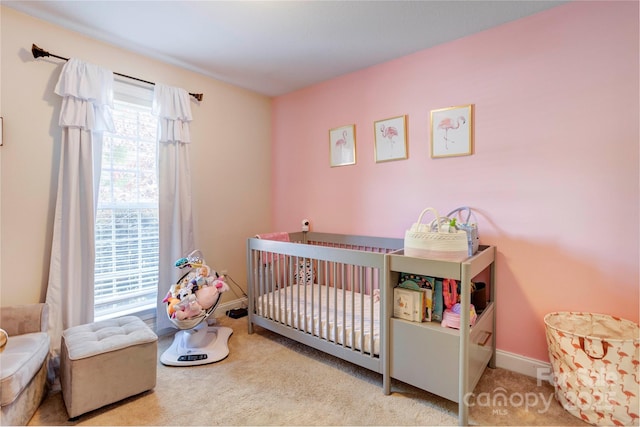 1209 Danielle Downs Ct SE, Concord, NC 28025 - carpeted bedroom with a nursery area and baseboards