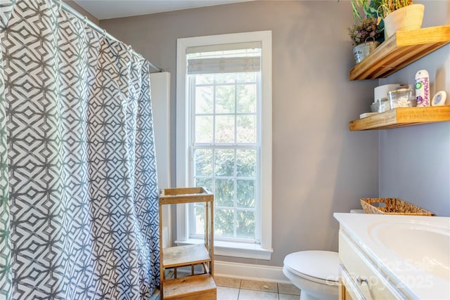 1209 Danielle Downs Ct SE, Concord, NC 28025 - full bathroom with toilet, vanity, tile patterned floors, a shower with curtain, and baseboards
