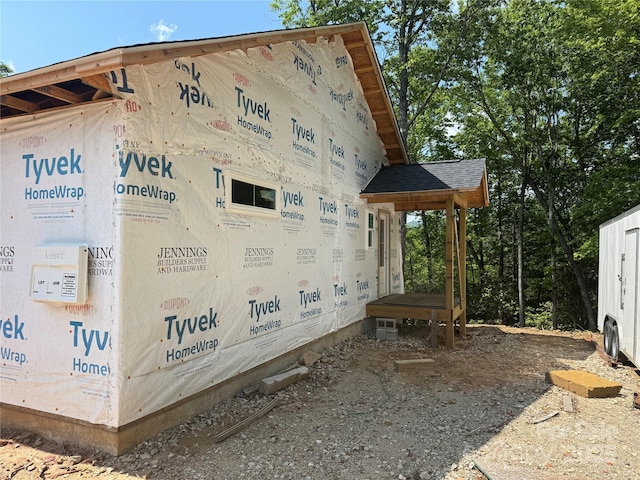 135 Wildwood Way, Lake Toxaway, NC 28747 - view of property exterior featuring roof with shingles