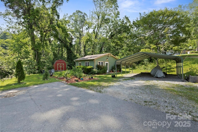 32 Roberts St, Fletcher, NC 28732 - view of front of house featuring driveway, a carport, and a front yard