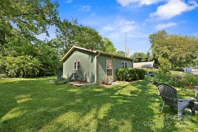 32 Roberts St, Fletcher, NC 28732 - back of property with concrete block siding and a yard