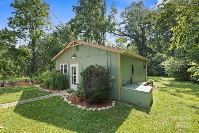 32 Roberts St, Fletcher, NC 28732 - view of side of property with a yard, concrete block siding, and board and batten siding