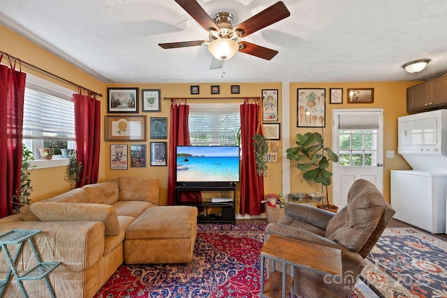32 Roberts St, Fletcher, NC 28732 - living room with stacked washer / drying machine, ceiling fan, and a textured ceiling