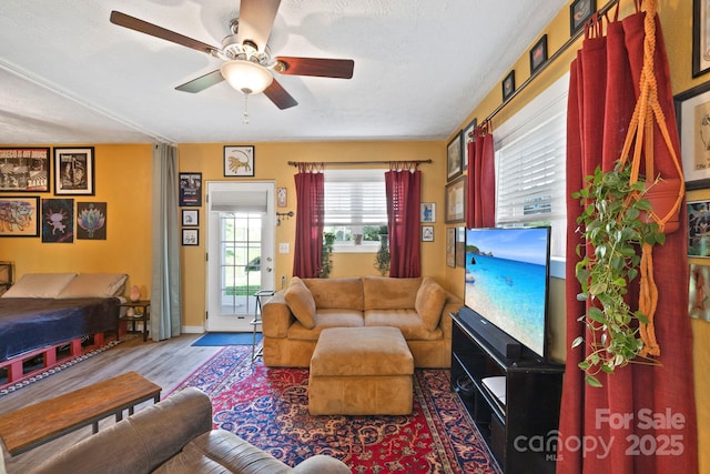32 Roberts St, Fletcher, NC 28732 - living area with ceiling fan, wood finished floors, baseboards, and a textured ceiling