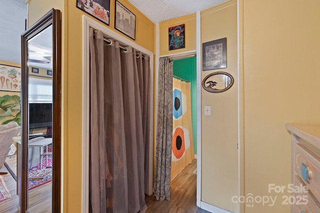 32 Roberts St, Fletcher, NC 28732 - hallway with wood finished floors and a textured ceiling