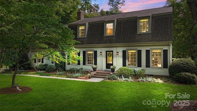 7213 Lancer Dr, Charlotte, NC 28226 - dutch colonial with roof with shingles, a lawn, and a chimney