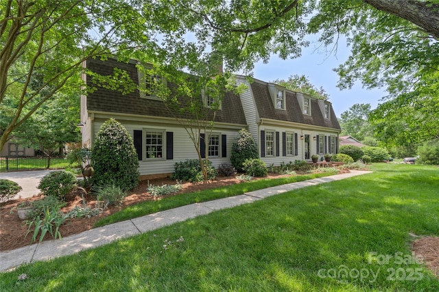 7213 Lancer Dr, Charlotte, NC 28226 - colonial inspired home featuring roof with shingles, a front yard, and a gambrel roof