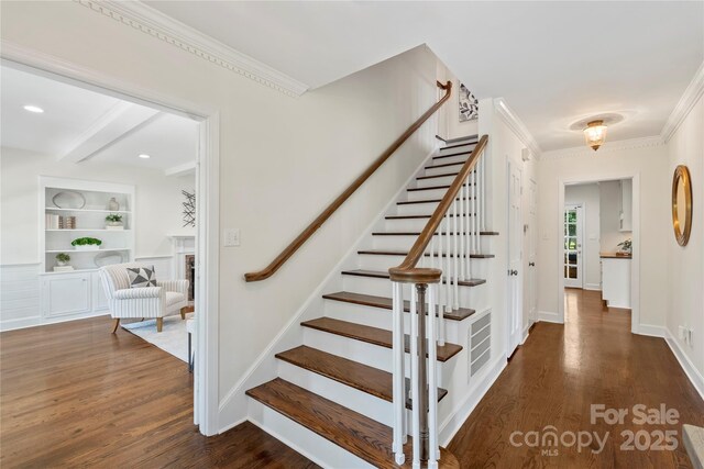 7213 Lancer Dr, Charlotte, NC 28226 - stairs featuring wood finished floors, crown molding, beamed ceiling, and baseboards
