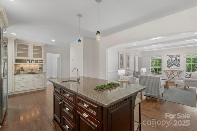 7213 Lancer Dr, Charlotte, NC 28226 - kitchen with a sink, open floor plan, a breakfast bar, dark wood finished floors, and recessed lighting