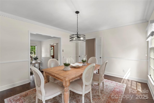7213 Lancer Dr, Charlotte, NC 28226 - dining space with a chandelier, crown molding, dark wood-type flooring, and baseboards