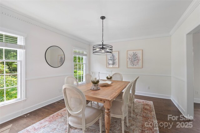 7213 Lancer Dr, Charlotte, NC 28226 - dining space with a chandelier, crown molding, dark wood-type flooring, and baseboards