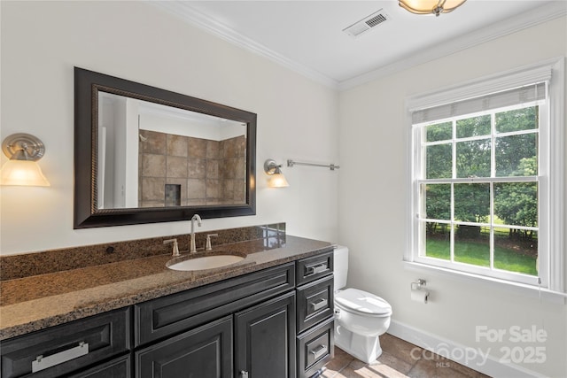 7213 Lancer Dr, Charlotte, NC 28226 - bathroom featuring crown molding, plenty of natural light, vanity, toilet, and baseboards
