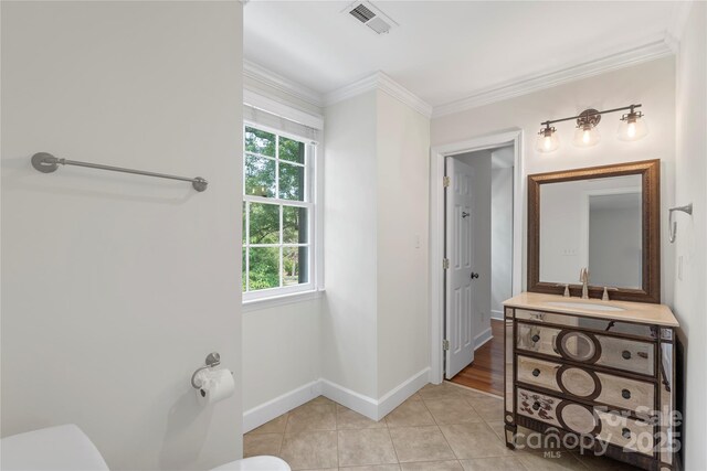 7213 Lancer Dr, Charlotte, NC 28226 - bathroom featuring toilet, vanity, tile patterned flooring, baseboards, and ornamental molding