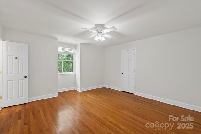 7213 Lancer Dr, Charlotte, NC 28226 - unfurnished room with a ceiling fan, baseboards, and wood finished floors