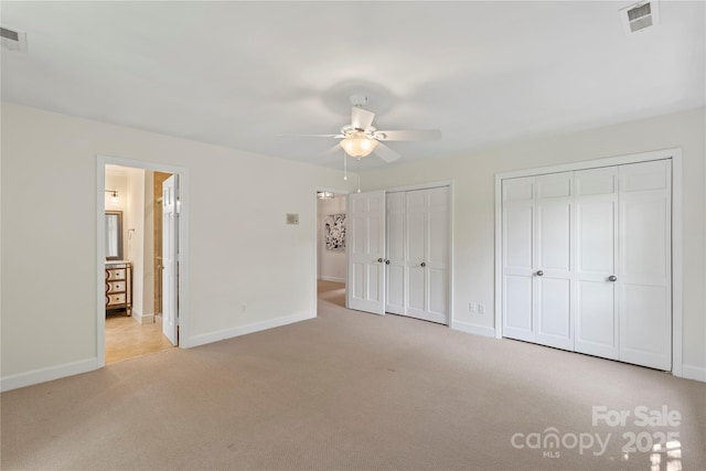 7213 Lancer Dr, Charlotte, NC 28226 - unfurnished bedroom with carpet floors, two closets, and baseboards